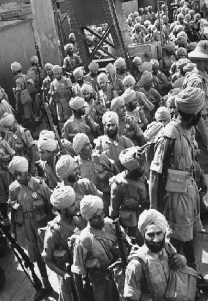 Sikh troops disembarkimg from ships into Malaya. Courtesy IWM. (446K)