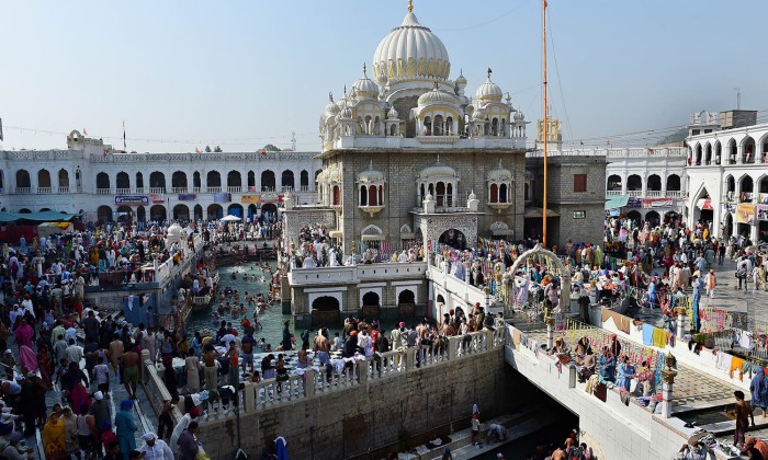 Sikh pilgrims gather at the Gurdwara Panja Sahib, one of Sikhism's most holy ... (120K)