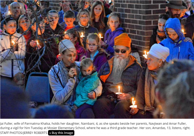 Khalsa remembrance vigil with candles.png